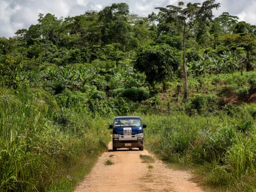 GHA_2019_Patient_Coordinator_Clement Ofosuhemeng_001-3000x2000-111bcae Clement Ofosuhemeng_ Traveling on a remote road to Faustina's village.