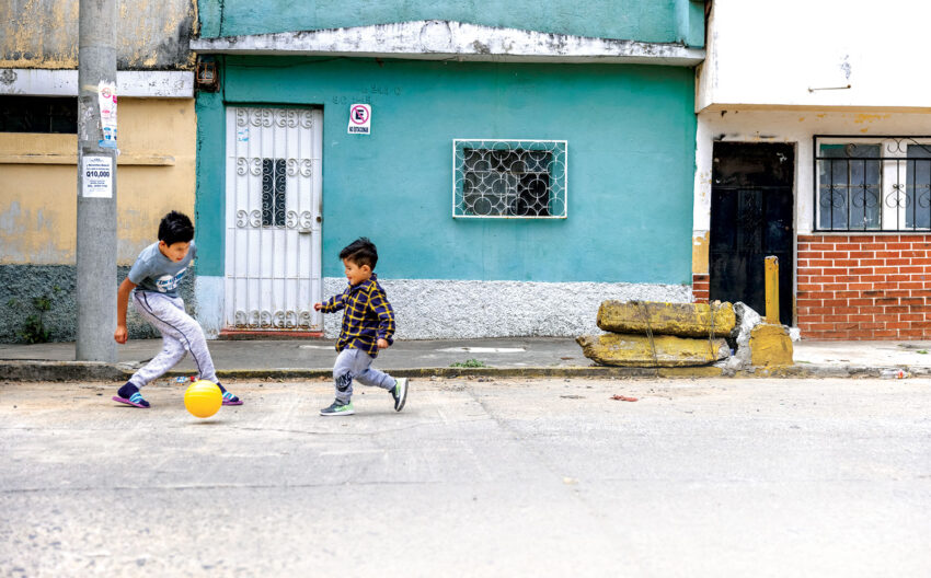 Dilan (right), age 4 with a friend