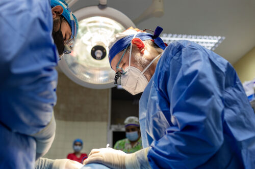 A group of surgeons performing a surgery