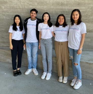 Students standing together, posing for the photo
